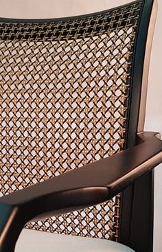 a close up of a chair with an arm rest