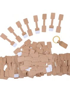 several pieces of cardboard are laid out next to a keychain and other items