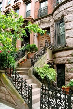 the stairs lead up to an apartment building