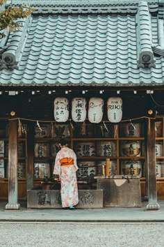 a woman standing in front of a store