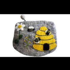 a rock with two bees and flowers on it