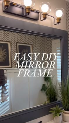 an easy diy mirror frame is shown in front of a bathroom sink with potted plants