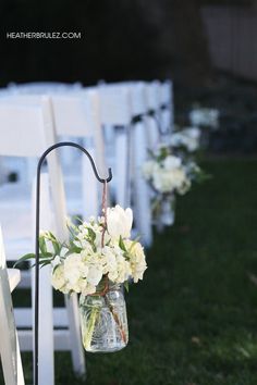 an instagram page with flowers and candles on the back of chairs for wedding ceremony