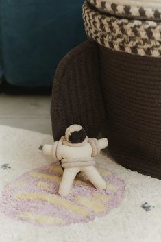 a small toy sitting on top of a rug