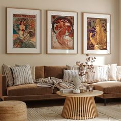 a living room filled with furniture and pictures on the wall above it's coffee table