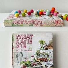 two books sitting next to each other with pom - poms on the covers