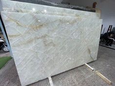 a large white marble slab sitting on top of a floor