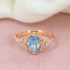 Embrace timeless elegance with our Swiss Blue Topaz Gold Ring, a stunning piece that radiates sophistication and grace. This exquisite ring, reminiscent of vintage style promise rings, captivates with its enchanting Swiss blue topaz gemstone.  Whether as an engagement ring symbolizing eternal love or a promise ring marking a cherished commitment, its beauty is undeniable. Crafted with meticulous attention to detail, this Swiss blue topaz ring is sure to become a treasured heirloom, adding a touc Luxury Light Blue Topaz Ring For Wedding, Luxury Light Blue Topaz Wedding Ring, Elegant Light Blue Sapphire Promise Ring, Luxury Blue Birthstone Ring For Wedding, Elegant Light Blue Crystal Promise Ring, Elegant Light Blue Birthstone Promise Ring, Fine Jewelry Blue Topaz Promise Ring, Fine Jewelry Blue Topaz Ring For Promise, Blue Topaz Birthstone Diamond Ring