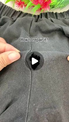 someone is removing the bottom part of their sweatpants with a flower in the background