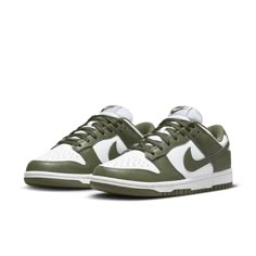 The Nike Women's Dunk Low 'Medium Olive' is the perfect blend of archival hoops style and contemporary design. Showcasing a classic two-tone color scheme, these comfortable sneakers feature a crisp white base with olive green overlays for added depth. The Nike Swoosh further accents the design in color-matched detail. Underpinned by a traditional rubber cupsole, the cushioning foam wedge provides superior comfort and impact protection, while the olive outsole ensures reliable traction when on the court. This updated version of the iconic Be True to Your School series from 1985 delivers timeless appeal with modern performance tech that make sure you stand out in style and comfort. Sneakers Outfit For Women, Nike Dunk Low Medium Olive, Back Too School, Fancy Sneakers, Dunks Shoes, Nike Tenis, Light Grey Leggings, Dunk Lows, Sneaker Trend