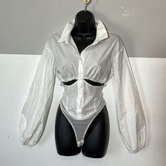 Description: White Button Down Shirt Body Suit. Mesh Bottom With Snap Closure. Sexy Cut Outs At Breastnice Elastic, Ballon Sleeves. Size: M Brand: Rehab Lab Condition: New - Never Worn Color: White Bust: Pit To Pit: 18” Fabric: Cotton, Spandex, Nylon Star Posh Ambassador Quality Merchandise A2 Accepting All Reasonable Offers Ships In One Day Comment Any Questions Summer Stretch Shirt With Buttons, Fitted Long Sleeve Cropped Shirt For Summer, Fitted White Cropped Shirt With Buttons, Fitted Long Sleeve Cropped Shirt For Day Out, White Tops With Buttons For Night Out, White Button-up Top For Night Out, Fitted Collared Blouse For Beach, Button-up Cotton Top For Night Out, Cotton Button-up Tops For Party