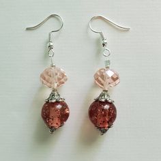 "\"PRISTINE PINK\" earrings These pretty pink earrings are made up of pale pink faceted glass beads, vintage round pink acrylic beads, silver etched metal beads, and silver seed beads. Approximate Measurements: Earring Length - 2.25 inches Earring Drop Length - 1.5 inches Earring Width - .5 inch *These earrings arrive in a handmade, hand-decorated box." Pink Round Beaded Earrings With Dangling Beads, Pink Round Earrings For Jewelry Making, Round Pink Earrings For Jewelry Making, Pink Czech Glass Jewelry For Party, Pink Czech Glass Party Jewelry, Nickel-free Pink Beaded Earrings, Pink Round Glass Jewelry, Pink Round Beaded Earrings, Pink Glass Round Jewelry