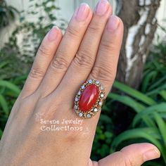 This beautiful oxtail red Coral Ring is set in 14k solid gold and a fancy diamond granulated setting! Ring Size: 7.25 Total Weight: 17.17 grams Precious Metal: 14k solid gold Precious stones: -Coral Center Stone: 20mm x 11mm -White Round diamonds: 0.4 ct Heirloom Red Jewelry With Cabochon, Heirloom Red Cabochon Jewelry, Victorian Oval Red Diamond Ring, Heirloom Red Jewelry With Diamond Accents, Victorian Style Red Oval Diamond Ring, Victorian Red Diamond Rings, Victorian Style Red Diamond Rings, Antique Red Diamond Ring With Gemstone, Antique Red Gemstone Diamond Ring