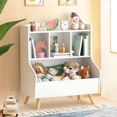 a white book shelf with stuffed animals and books on it in a child's room