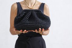 "BLACK Metallic Raffia Bag, Raffia Cloud Clutch, Raffia Bag, HandBag Crochet Clutch, Hand Knit Clutch, Evening Clutch, Raffia Clutch All pictures are Medium Size A leather clutch is an essential accessory, whether you prefer a pouch, fold-over, or drawstring design. In particular, one with clean lines or matted tone hardware is ideal for transitioning from day to night, with casual and elegant attire. One piece is ready for shipping Black Color Metallic effect, Leather  Yarn Lining Turkish Satin Elegant Black Woven Shoulder Bag, Elegant Black Woven Crochet Bag, Elegant Black Handwoven Crochet Bag, Black Crochet Pouch Bag For Daily Use, Elegant Black Crochet Travel Bag, Black Woven Clutch Shoulder Bag, Black Woven Clutch Bag, Black Handwoven Clutch Bag, Handmade Black Crochet Pouch Bag