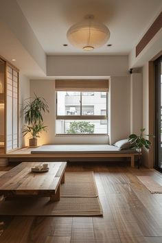 a living room filled with furniture and a large window next to a wooden coffee table