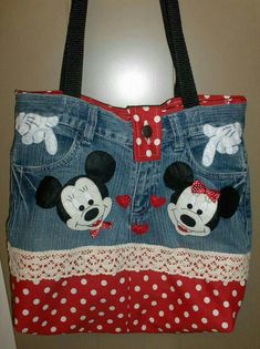 a purse with mickey and minnie mouse on it