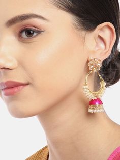 These beautiful pink & gold toned floral hoop jhumka earrings come with kundan stone studs & beads, are gold-plated, and are secured with a circular twist closure. These handcrafted jhumkas can be paired with any traditional outfit to add a punch of colorful boost, and help you stand out. Size Length: 7.5 cm Product color may vary based on the monitor or screen you are using.See FAQ for more details. Details Material: BrassStones: Kundan & Artificial BeadsPlating: Gold-plated Kundan Hoop Earrings For Celebration, Festive Round Kundan Hoop Earrings, Kundan Hoop Earrings With Tilla, Celebration Zari Work Jhumkas, Festive Kundan Drop Hoop Earrings, Kundan Hoop Earrings For Festive Occasions, Pink Chandbali Danglers For Diwali, Temple Jewelry Style Round Jhumkas With Gota Work, Temple Jewelry Style Gota Work Jhumkas