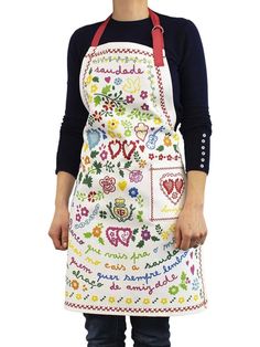 a woman wearing an apron with flowers on it