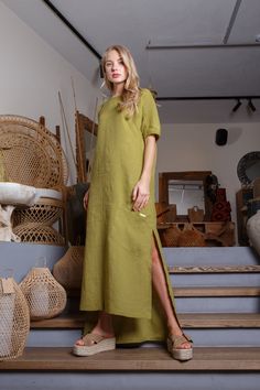 If you want a solid linen dress - that's a choice! Asymmetrical long green color linen dress would make you feel awesome.  This dress is made of 100% washed, natural Baltic linen (EU) GIFT - FREE SHIPPING WORLDWIDE * ENLI5 Linen - it's our family creation... for you with love... _ DESCRIPTION  - made from 100% Baltic linen - asymmetrical length  - dress has two comfortable pockets  - model height is 5.7ft (174 cm.) she wears size M - handmade by ENLI5 Linen family in Lithuania (EU) - Color may vary due to different displays * WHY TO CHOOSE US? Every dress is made individually for our clients. If you need small changes in size, please write us a message and together we would find the solution. Our linen is twice washed, so it gets better shape, stylish wrinkles and  indescribable tenderness Solid Linen Maxi Dress For Vacation, Beach Linen Dress With Side Slits, Linen Beach Dresses With Side Slits, Relaxed Fit Maxi Dress With Side Slits, Spring Linen Maxi Dress With Side Slits, Relaxed Fit Solid Color Linen Dress, Green Maxi Dress With Side Slits For Summer, Casual Green Dresses With Side Slits, Casual Green Dress With Side Slits