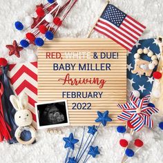 red, white and blue baby announcement surrounded by patriotic items