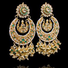 This stunning design is sure to spice up your festive look! The look includes earrings, teekah and jhoomar. Transform any attire in this earrings, maang teekah and headpiece set featuring intricate pearl moti work and accented with kundan stones. Approximate earrings length is 4". Gold-plated on high-quality brass as base metal. Made by order. Kindly allow 4-6 weeks for the delivery of this item. For custom or urgent requests, please contact support@alacouture.com. *Please Note: We use faux ston Kundan Jhumkas For Eid Reception, Festive Chandbalis With Gota Work For Reception, Festive Gota Work Chandbalis For Reception, Kundan Bridal Earrings For Eid Reception, Kundan Bridal Earrings For Reception At Eid, Kundan Jhumkas With Gota Work For Reception, Mirror Work Jhumkas For Diwali Reception, Traditional Chandbalis With Mirror Work For Reception, Bollywood Style Gota Work Danglers For Reception