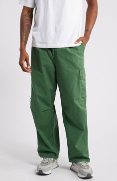 Stay comfy in these cargo pants cut from durable organic-cotton twill with roomy pleats at the waist and knees for ease of movement. 27 1/2" inseam; 19" leg opening; 13" front rise; 15 1/2" back rise (size 32) Zip fly with button closure Front slant pockets; cargo flap-patch pockets; back flap pockets 100% organic cotton Machine wash, tumble dry Imported Wide Leg Cotton Cargo Pants With Multiple Pockets, Green Relaxed Fit Cargo Pants With Patch Pockets, Green Relaxed Fit Cargo Jeans With Multiple Pockets, Relaxed Fit Green Cargo Jeans With Hip Pockets, Spring Cotton Cargo Jeans For Elevated Casual, Relaxed Fit Parachute Pants For Casual Wear, Smart Casual Wide Leg Cotton Cargo Pants, Wide-leg Cotton Work Pants With Side Pockets, Elevated Casual Cotton Cargo Jeans For Spring