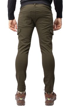 Solid chino pants constructed from comfortable stretch twill feature roomy cargo pockets for contemporary style. 13" leg opening; 9 3/4" front rise (size 32x32) Zip fly with button closure Five-pocket style Leg cargo pockets Skinny leg Stretch twill construction 64% cotton, 33% polyester, 3% spandex Machine wash, tumble dry Imported Model stats: 6'1" height, 32" waist. Model is wearing size 32x32. Stretch Cargo Pants For Fall, Stretch Cargo Pants With Side Pockets For Fall, Stretch Fall Cargo Pants With Side Pockets, Fall Stretch Cargo Pants With Side Pockets, Khaki Cargo Pocket Chinos, Khaki Chinos With Cargo Pockets, Utility Cargo Chinos For Fall, Utility Cargo Style Chinos For Fall, Khaki Tapered Leg Cargo Pants