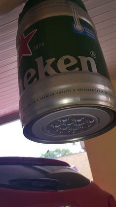 a can of beer is hanging from the ceiling