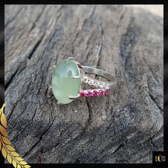 "Prehnite is a captivating gemstone with a soothing green color. Revered for its calming energy and ethereal glow, it promotes harmony and personal growth. Adorn yourself with nature's serene embrace. * Gemstone: Prehnite & Cubic Zirconia * Gem color: Green, White & Pink * Size: 10x14 mm * Weight: 5.45 ct. * Metal Purity: 925 Sterling Silver  * Usage: For Girls & women Jewels as Unique as You Are 💎💖 Keep Noted- All the products' photographs are taken under natural light or a flashlight. However, the color you see in the picture may be a little different compared with the real product. We always try our best to capture the photos so that you can get a clear view of the product ♥ If you require any other assistance, I would be more than happy to help you. ♥ If You Like Our Product, Please Spiritual Emerald Ring With Natural Stones For Gift, Handmade Green Jade Rings, Spiritual Jade Rings As Gift, Green Crystal Ring With Natural Stones, Green Gemstone Crystal Ring, Green Crystal Gemstone Ring, Green Sterling Silver Spiritual Rings, Jade Gemstone Rings For Healing, Unique Green Tourmaline Rings