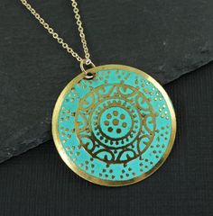 Turquoise and gold medallion necklace features a round gold disc embossed with an ornate design and colored with turquoise enamel. Pendant has a distressed feel with some dark areas on the pendant. This is part of its style. Pendant is 1 3/16 inches in diameter (30mm). Your choice of chain lengths - 16 or 18 inches. Chain is gold plated. Find more necklace styles here - https://www.etsy.com/shop/CharleneSevier?ref=hdr_shop_menu&section_id=10084290 Sign up for my newsletter! Copy and paste this link in your browser - http://eepurl.com/iSq7Wc ---------------------------------- PLEASE READ: This item is not intended for children where choking is a hazard. ---------------------------------- Necklace Styles, Gold Medallion Necklace, Turquoise And Gold, Ornate Design, Gold Medallion, Gold Disc, Newport News, Medallion Necklace, Chain Lengths