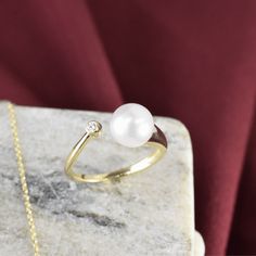 Introducing our 14K Cultured Pearl Bypass Ring – an elegant fusion of timeless charm and exceptional craftsmanship. Fine Jewelry Bypass Ring For Formal Events, Formal Fine Jewelry Bypass Ring, Formal 14k Gold Pearl Ring With Round Band, 14k Gold Promise Ring With Classic Design, Timeless Yellow Gold Bypass Ring For Formal Occasions, Classic Jewelry Ring With Timeless Design, Fine Jewelry Yellow Gold Rings With Timeless Design, Classic Ring With Timeless Design As Gift, Classic Rings With Timeless Design As Gift