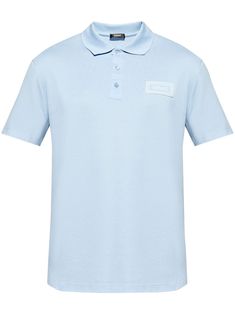 light blue cotton piqué weave polo collar logo patch at the chest front button placket short sleeves straight hem