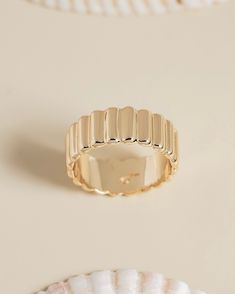 Material: 12k gold plated over brassDimensions: 9mm *wider band rings fit more snug than narrow bands. we recommend ordering one size up from your narrow band ring size. Eclair Ring, Wide Band Rings, Eclairs, Ring Fit, Put A Ring On It, Wide Bands, Band Ring, Band Rings, Gold Rings