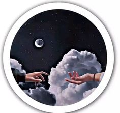 two hands reaching out to each other in front of a sky with clouds and the moon