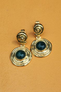 Delight in the timeless beauty of the Tethys Earring. Artfully crafted with ancient Greek details, these earrings add a unique & elegant touch to any outfit! INOOKU was established in 2016 and is based in central Athens. All INOOKU pieces are handmade, ethically and traditionally created with techniques inspired by the ancient Greeks. All pieces are handmade with attention to detail by highly skilled technicians, and through ecologically-friendly procedures.Handcrafted in fine 925 silver with 18 Elegant Artistic Drop Earrings Jewelry, Elegant Metal Jewelry With Artistic Design, Elegant Artistic Drop Earrings, Elegant Artistic Design Drop Earrings, Elegant Round Earrings With Artistic Design, Elegant Brass Earrings With Artistic Design, Gold Sterling Silver Earrings With Artistic Design, Elegant Bronze Clip-on Earrings As Gift, Elegant Bronze Clip-on Earrings For Gift