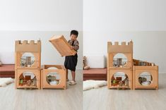 a young boy standing in front of some wooden toys