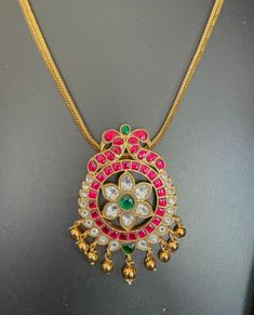 Jadau Kundan pendant with gold-finished chain. Brass based pendants and hand made. Brass Pendant Necklace For Celebration, Fusion Style Brass Pendant Necklace, Festive Brass Pendant Necklace, Festive Gold Kundan Necklace With Pearl Pendant, Gold Necklace With Detachable Square Pendant, Large Round Pendant Necklaces For Festivals, Traditional Locket Necklace With Oval Pendant, Traditional Yellow Gold Flower Pendant Necklace, Festive Gold Plated Kundan Pendant Necklace