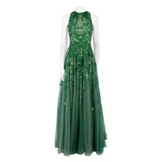 CONDITION is Never Worn With Tag. Minimal wear to dress is evident. Minimal wear to the embellishment with loose wire threads unravelling at the front bodice, front skirt and rear hip on this used Honayda designer resale item. Details AW22 Green Synthetic Maxi gown Floral beads embellishment Round neckline Tulle layered accent Back zip closure with hook and eye Made in Lebanon Composition 100% Polyamide Care instructions: Professional dry clean only Size & Fit Product measurements: Shoulders: 21 Evening Gown With Intricate Embroidery And Sleeveless Design, Sleeveless Evening Gown With Intricate Embroidery, Holiday Embellished Floor-length Dresses, Green Hand Embellished Evening Dress, Glamorous Embellished Green Maxi Dress, Glamorous Embroidered Evening Gown, Sleeveless Party Gown With Intricate Embroidery, Embellished Floor-length Evening Dress, Sleeveless Embellished Green Maxi Dress