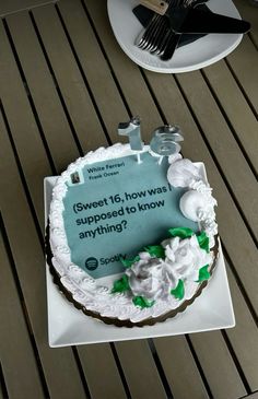 a cake that is sitting on top of a table with a sign saying sweet 16, how was supposed to know anything?