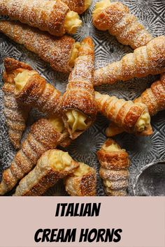 croissants on a plate with the words italian cream horns in front of them