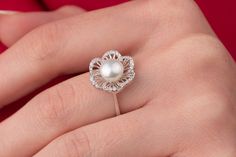 Our art deco pearl ring is 14k solid white gold. Its flower leaves are decorated with zircon stones that look fascinating. The big pearl is settled in the middle of the flower. When you think of this big pearl ring as a gift for your loved ones, it will be a great gift choice. Our gold pearl ring makes happy your loved ones on their birthdays, graduations, anniversaries, mother's day, valentine's day, or women's day. 🎁 If you want, you can add a gift note for your loved ones. It arrives in a sp Pearl Anniversary Rings, Luxury Round Cut Pearl Promise Ring, White Pearl Engagement Rings, Luxury Pearl Ring For Wedding, Luxury White Pearl Promise Ring, Luxury Rose Gold Pearl Ring In Fine Jewelry Style, Luxury Minimalist Pearl Ring For Anniversary, Luxury Dainty Pearl Ring For Anniversary, Dainty Luxury Pearl Ring For Anniversary