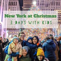 a group of people standing in front of a christmas tree with the words new york at christmas 3 days with kids