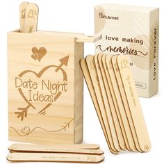 wooden matchbox with matching matches and personalized date night tags in it next to box