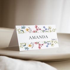 a place card sitting on top of a white plate