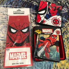 two spider - man coasters, one is red and the other is black