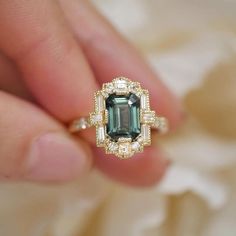 Multi-Cut Engagement Ring, Green Emerald Gemstone Ring, Milgrain Ring, Halo Wedding Ring, Solitaire WithAccent Ring, Bezel Set Ring,14KGold  Item Description: *Main Stone: Cubic Zirconia *Stone Shape: emerald Side Stone: Cubic Zirconia 1. White Gold: 10K/14K/18K 2. Yellow Gold: 10K/14K/18K 3. Rose Gold: 10K/14K/18K 4. Silver: Sterling Silver 925 Size Customization: What Size you want... * You can also Customize ring size in US 4 to US 12! It sometimes affects to price. * Main Stone & Shape Custo Heirloom Style Emerald Cut Sapphire Ring With Accent Stones, Heirloom Emerald-cut Sapphire Ring With Accent Stones, Heirloom Emerald Cut Sapphire Ring With Accent Stones, Heirloom Sapphire Ring With Emerald Cut And Accent Stones, Moissanite Baguette Cut Gemstone Ring, Wedding Sapphire Ring Baguette Cut, Moissanite Gemstone Rings In Baguette Cut, Wedding Baguette Cut Topaz Ring With Accent Stones, Baguette Cut Topaz Wedding Ring