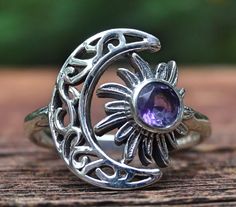 ☾Handmade, Natural Amethyst Sterling Silver Detailed Moon & Sun Ring Size 6.5☾ ❤︎Featured in this listing is a sterling silver, handmade, natural stone ring. This lovely ring features a beautiful, Natural Purple Amethyst Moon round stone. The round Amethyst gemstone has been bezel set into Sun within a handmade, detailed Crescent Moon Ring setting. ❤︎Highly polished smooth 2mm band, with the size of the detailed moon at 16x14mm ❤︎100% Natural untreated stone Stone: Natural Amethyst (5mm) Metal: Mystical Silver Amethyst Ring, Celestial Amethyst Moon Phase Jewelry, Mystical Round Amethyst Ring, Bohemian Amethyst Sterling Silver Ring, Silver Amethyst Moon Phase Jewelry, Celestial Round Amethyst Jewelry, Silver Amethyst Jewelry With Moon Phase, Celestial Style Round Amethyst Jewelry, Sun Ring