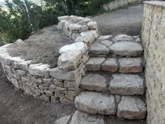 a stone wall with steps made out of rocks