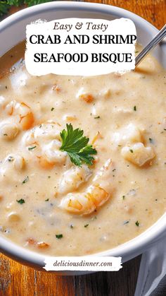 a bowl of crab and shrimp seafood bisque on a wooden table with parsley